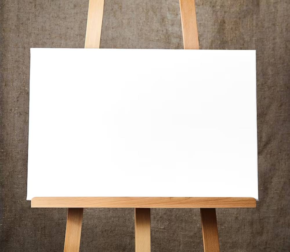 A blank white canvas on a wooden easel, set against a textured brown backdrop, ready for artistic creation.